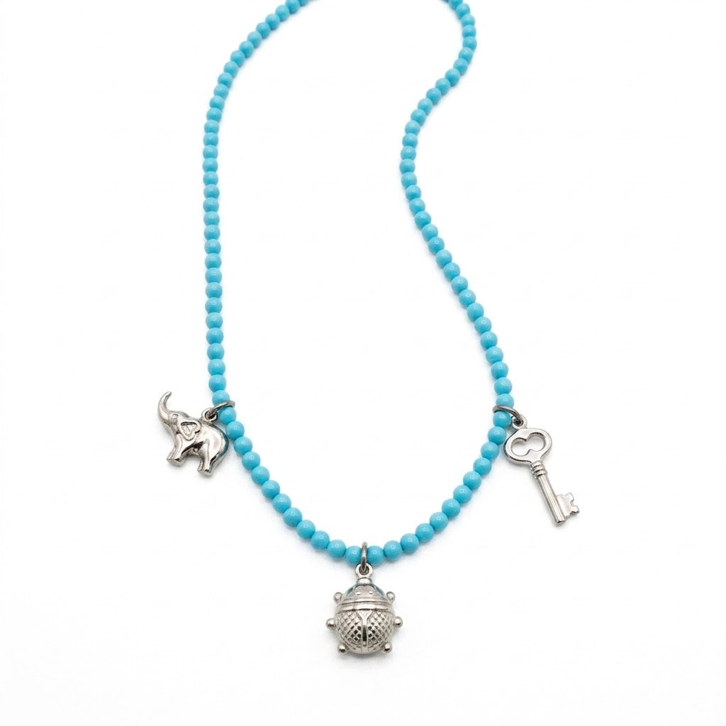 Collana in Sfere di Turchese con Pendenti Portafortuna in Argento 925